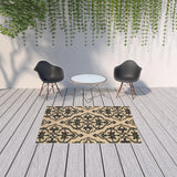 5' x 8' Beige and Black Medallion Stain Resistant Indoor Outdoor Area Rug