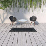 2' X 8' Black and Ivory Stain Resistant Indoor Outdoor Area Rug