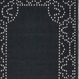 2' X 8' Black and Ivory Stain Resistant Indoor Outdoor Area Rug