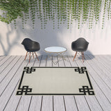 7' x 9' Beige and Black Stain Resistant Indoor Outdoor Area Rug