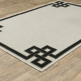 7' x 9' Beige and Black Stain Resistant Indoor Outdoor Area Rug