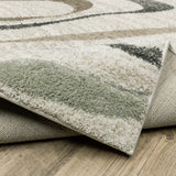 6' X 9' Beige Grey Sage Green Pale Blue Brown And Charcoal Geometric Power Loom Stain Resistant Area Rug