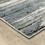 8' X 11' Blue Grey And Beige Abstract Power Loom Stain Resistant Area Rug