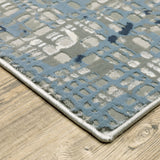 6' X 9' Blue Ivory Grey Brown Beige And Light Blue Abstract Power Loom Stain Resistant Area Rug