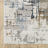 10' X 13' Grey Blue Navy Ivory And Brown Abstract Power Loom Stain Resistant Area Rug