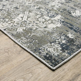 10' X 13' Ivory Grey Blue And Taupe Abstract Power Loom Stain Resistant Area Rug