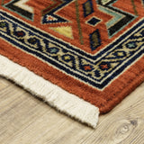 5' X 8' Red Blue Orange And Beige Oriental Power Loom Stain Resistant Area Rug With Fringe