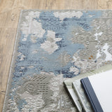 8' X 11' Blue Ivory Grey Brown Beige And Light Blue Abstract Power Loom Stain Resistant Area Rug