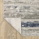 8' X 11' Grey Blue Ivory Brown And Navy Abstract Power Loom Stain Resistant Area Rug