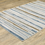 8' X 11' Blue Ivory Grey Light Blue And Brown Abstract Power Loom Stain Resistant Area Rug