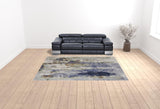 9' X 12' Blue Orange And Ivory Abstract Power Loom Area Rug