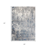 9' x 12' Blue and Gray Abstract Power Loom Area Rug