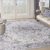 9' x 12' Blue and Ivory Floral Power Loom Distressed Washable Area Rug