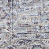 9' x 12' Beige and Ivory Floral Power Loom Distressed Washable Area Rug